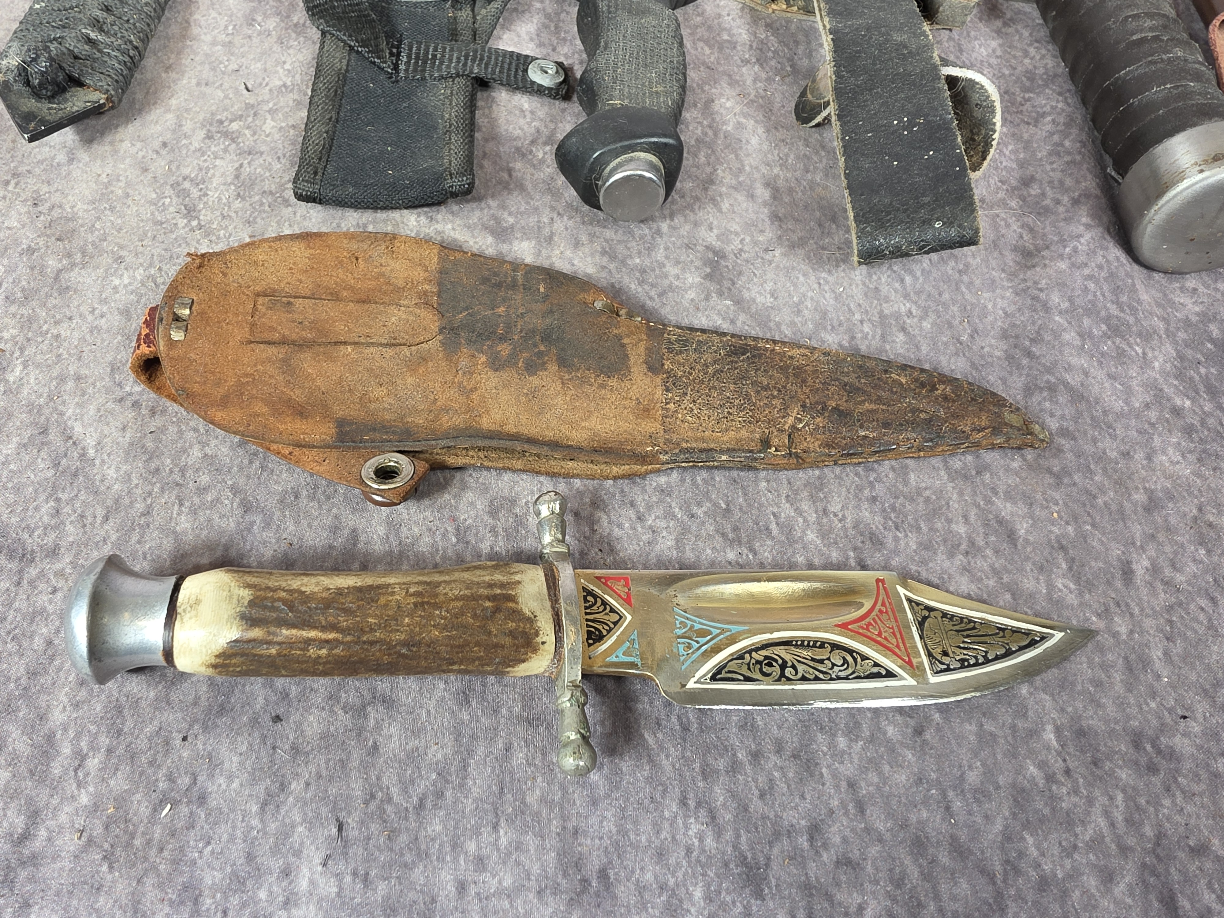 A Collection of Fixed Blade Hunting, Survival, and Decorative Knives