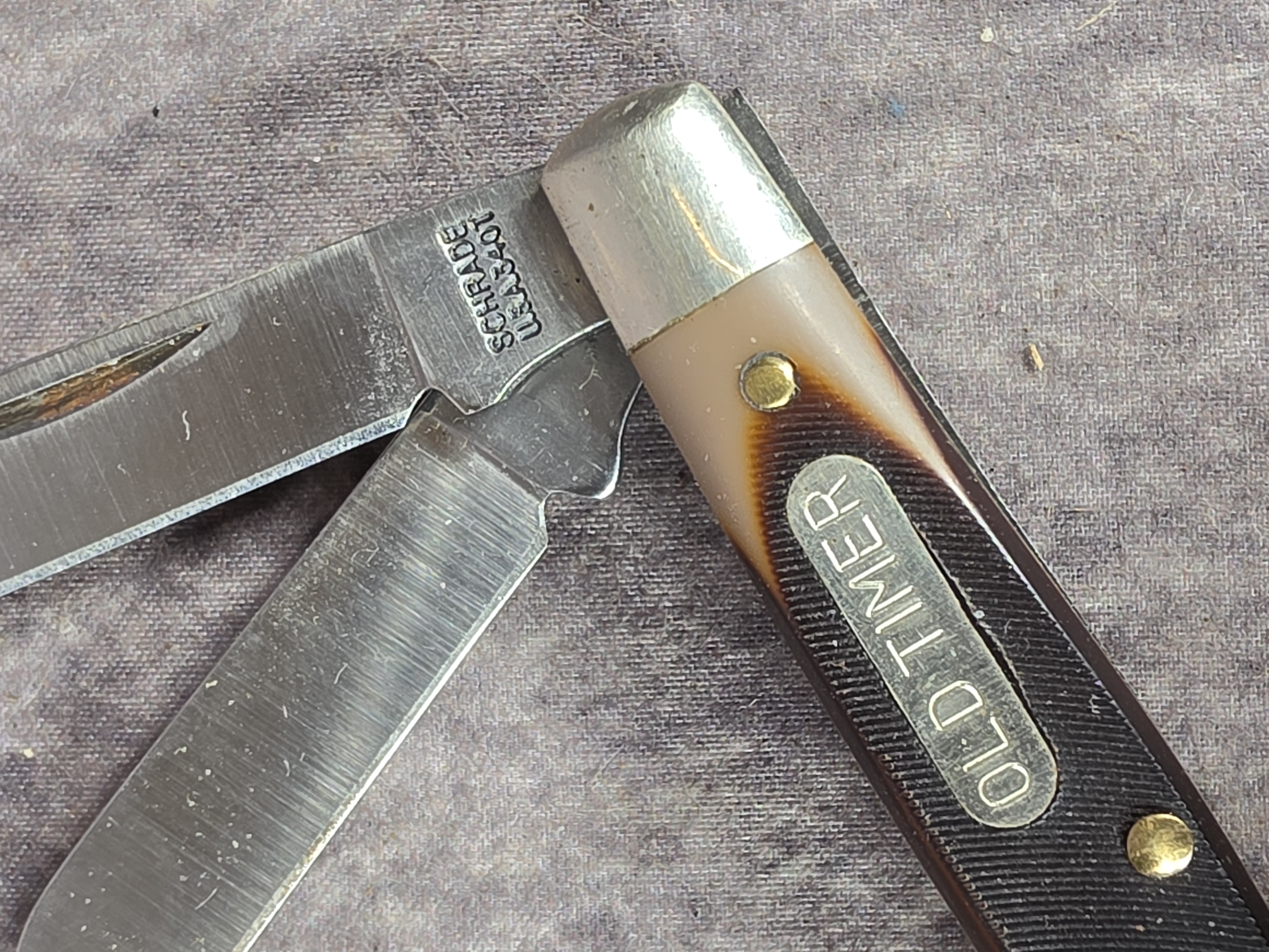 A Collection of Five Schrade Old Timer and Uncle Henry Pocket Knives