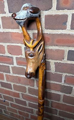 Carved Folk Art Zoomorphic Wooden Walking Stick with Glass Inset Eyes. Shipping is available on 