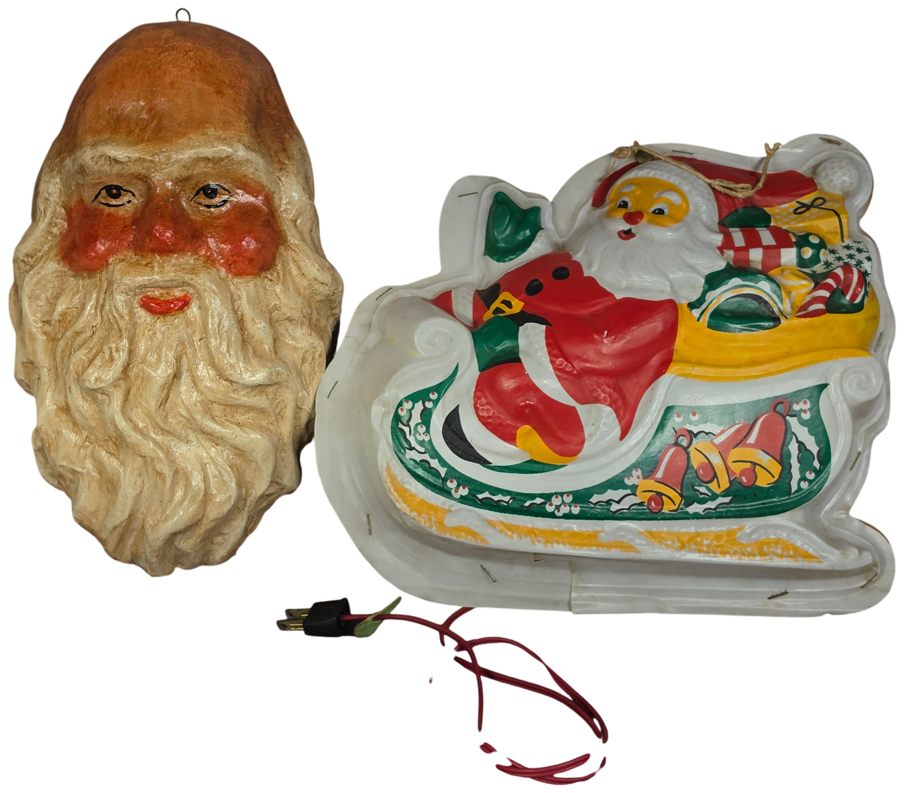Two Vintage Christmas Wall Decorations Including Molded Paper-Mache Santa Face and Lighted Vacuum-Formed Sleigh Plaque