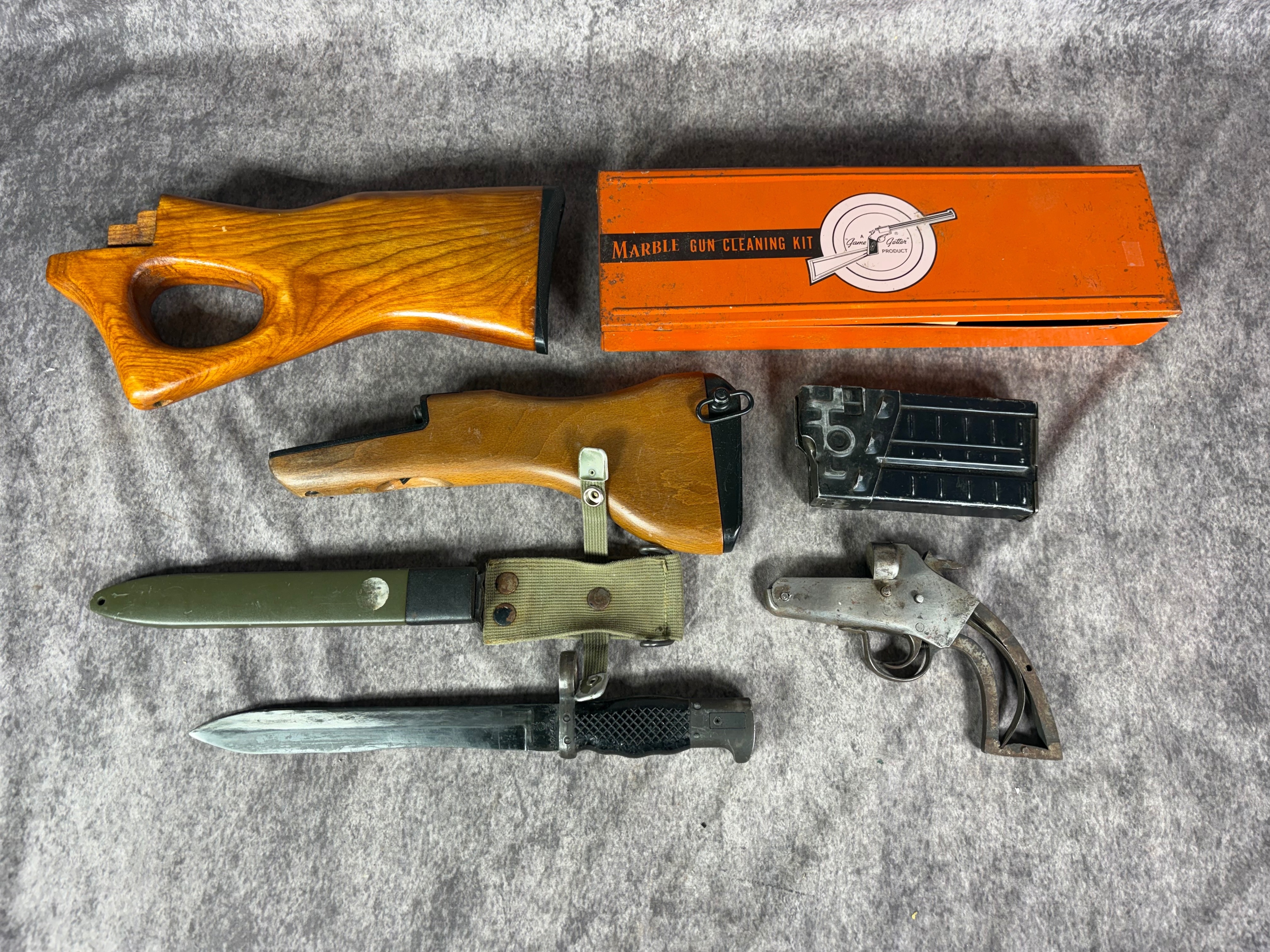 A Collection of Military and Sporting Firearms Accessories Including Flare Gun and Edged Weapons