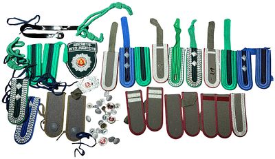 An Assortment of East German (DDR) Volkspolizei Uniform Insignia and Accoutrements. A collection 