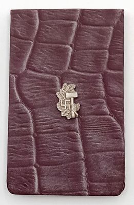 A 3rd Reich era Note Book with a rare badge of the NDSAP Students 2nd form on the front. Unused 