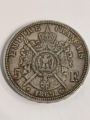 1869 NAPOLEON III SILVER 5 FRANC COIN. Extra fine condition. Complete with capsule.