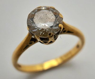 An 18K Yellow Gold White Stone Solitaire Ring. Size M. 3.3g total weight.