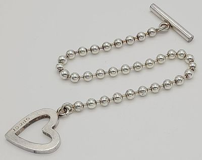 A Gucci Designer Sterling Silver Heart Bracelet. Comes with original Gucci packaging. 20cm. 