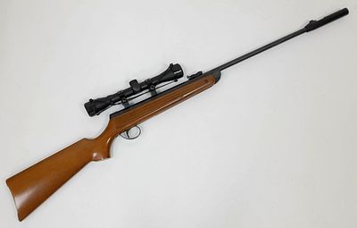 A Vintage BSA Meteor .22 Calibre Air Rifle. Break-barrel. Wood stock. Comes with an attached 