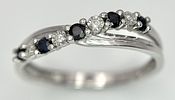 A 9K WHITE GOLD DIAMOND AND SAPPHIRE CROSSOVER RING. 1.5G. SIZE N. SC - 1030.Image - 2