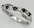 A 9K WHITE GOLD DIAMOND AND SAPPHIRE CROSSOVER RING. 1.5G. SIZE N. SC - 1030.Image - 3