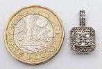 A 10K WHITE GOLD DIAMOND SET PENDANT - 1.3G. 18MM.Image - 2
