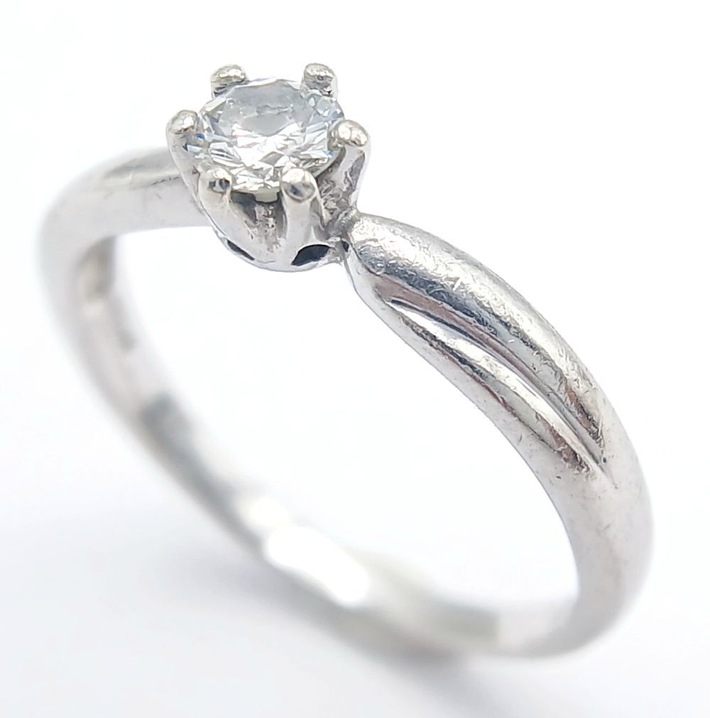 A PLATINUM DIAMOND SOLITAIRE RING - 0.21CT. 2.8G. SIZE K. SC - 1068.