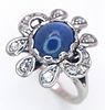 A 18K white gold diamond and sapphire fancy ring, 0.20ct diamond weight, 9x7mm cabochon Image - 2