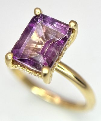 An 18k yellow gold diamond and amethyst ring. 0.1ct diamond. 2.25ct amethyst. 3.5g total