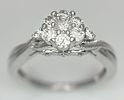 A 9k white gold, diamond cluster ring, 0.20ct diamond, 3.1g total weight, size J. 2613H.Image - 1