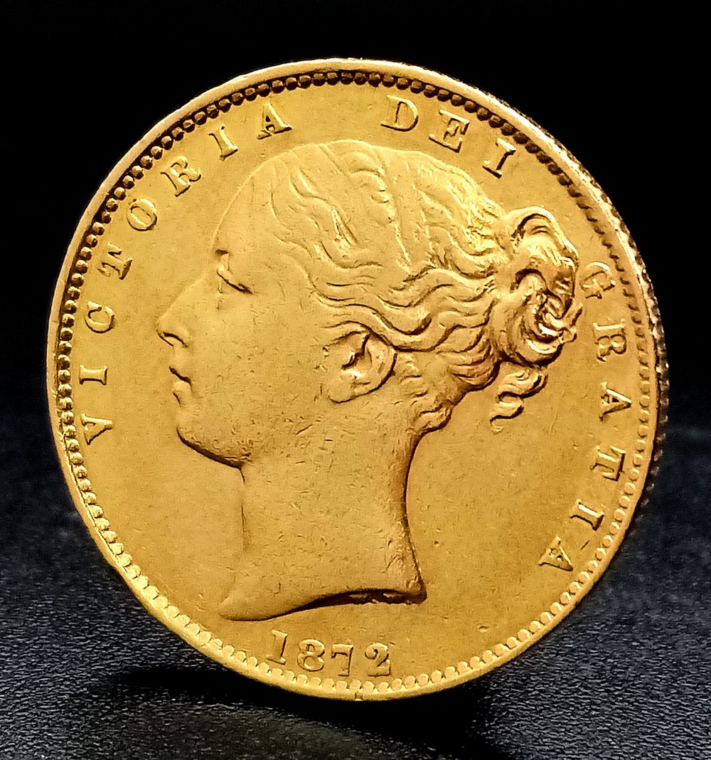 An 1872 Queen Victoria, 22K Gold Full Sovereign Coin. Shield back. Melbourne mint. EF grade but 