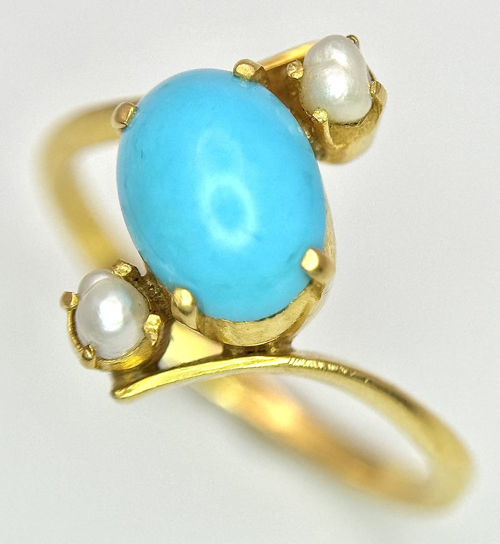 An 18k yellow gold turquoise and pearl ring. 8x6mm turquoise cabochon, 3.3g total weight, size 