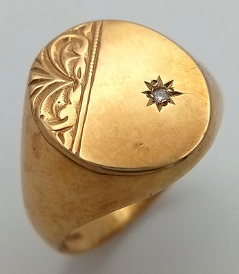 A 9k yellow gold diamond oval signet ring. 5.3g total weight. 0.01ct diamond weight. size X.