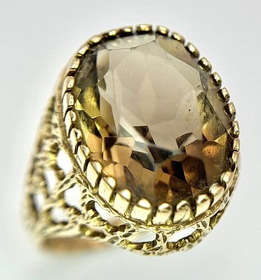 A 9k yellow gold Smokey quartz ring - 1.5cmx1.2cm quartz size. 5.4g total weight. Size M. SH1912I.