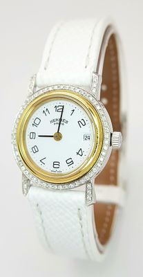 An Hermes, Designer Ladies Quartz Diamond Watch. White leather strap. Diamond bezel. Case -