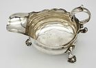 An Antique Georgian Sterling Silver Sauce Boat. C scroll handle and standing on three webbed Image - 4