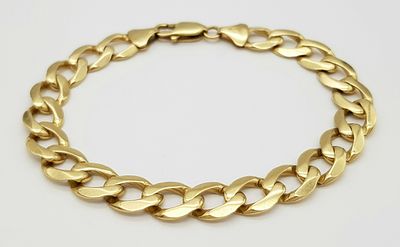 A 21cms 9K GOLD CURB LINK UNISEX BRACELET . 23.5gms