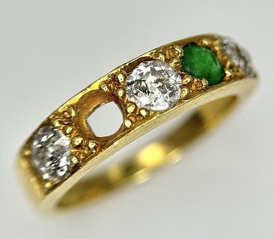 An 18K Yellow Gold Diamond and Emerald Ring. 0.60ctw of brilliant round cut diamonds. Note: One