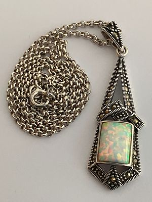 A ‘LUKE STOCKLEY’ OPAL SET SILVER PENDANT and CHAIN. Pendant x 4.75 cm. Silver Belcher Link