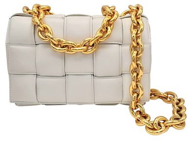 A Bottega Veneta Ivory Padded Cassette Bag. Woven padded leather exterior with gold-toned