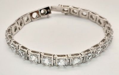 A 2013 Hallmarked Sterling Silver and White Topaz Set Tennis Bracelet- 18.5cm Length. 6mm