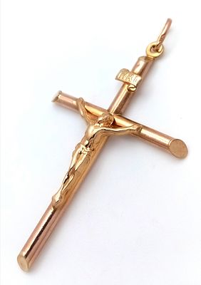 A 9k yellow gold crucifix pendant, 5cm X 3cm, 2.4g total weight. Ref TC04.