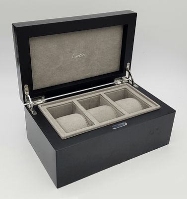 A CARTIER POLISHED EBONY 3 WATCH STORAGE BOX 24 X 15 X 11 COMING IN THE ORIGINAL CARTIER OUTER BOX .