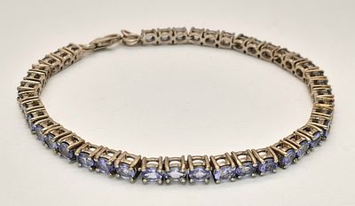 A Stylish Sterling Silver Tanzanite Set Tennis Bracelet-20cm Length. Set with Forty-Two 4mm
