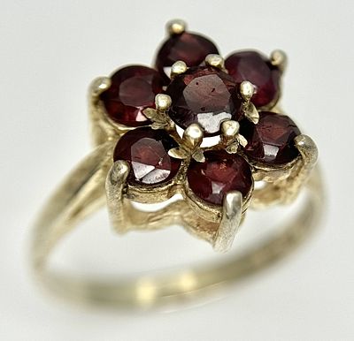 A Vintage, 1979 Hallmarked, Sterling Silver and Garnet Set Cluster Ring Size Q1/2. The Crown