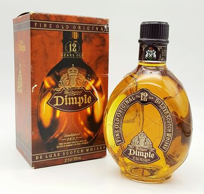 A 1980’s Bottle of 12-Year-Old Dimple De Luxe Scotch Whisky. 37.5 Cl in Original Box. Sealed