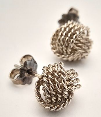 A Pair of Tiffany & Co. 925 Silver Knot Stud Earrings. 1cm diameter, 2.79g total weight.