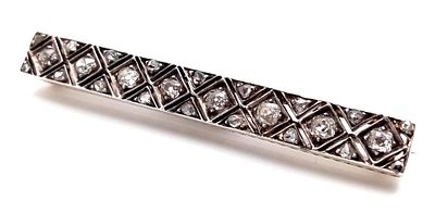 An Art Deco Gold, Silver and Diamond Bar Brooch. A geometric diamond delight with c. 2.2ctw of