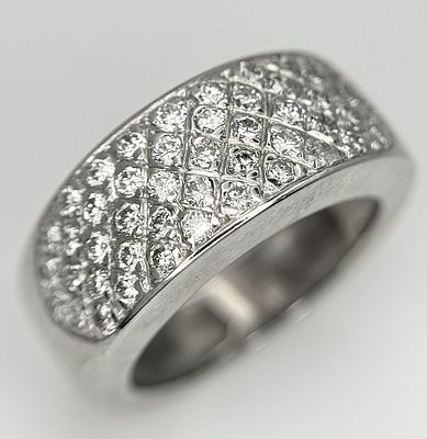 An 18K White Gold Diamond Pave Band Ring. 0.20ctw diamonds, 6.7g total weight, ring size I.