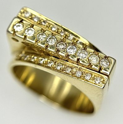 An 18K Gold and Diamond Fancy Dress Ring. A row of round brilliant cut diamonds with a mirrored