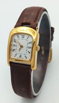 A Designer 'Coach' Quartz Ladies Watch. Brown leather strap, Gilded case - 20mm. White dial. In