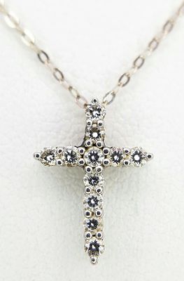A Tiffany and Co. 950 Platinum and Diamond Cross Pendant on an 18k White Gold Chain necklace. 
