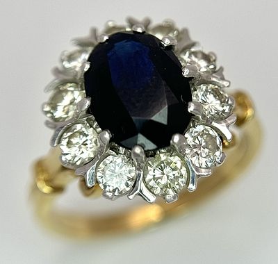 A Stunning W.G.I Certified 18K Yellow and White Gold, Diamond and Sapphire Ring. Reminiscent of 