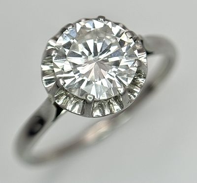 A W.G.I Certified Platinum (950 purity tested) and Diamond Ring. A 1.65ct round brilliant cut 