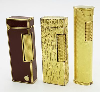 A Trio of Different Style Vintage Dunhill Lighters. All in need of gas and flints so as found. 
