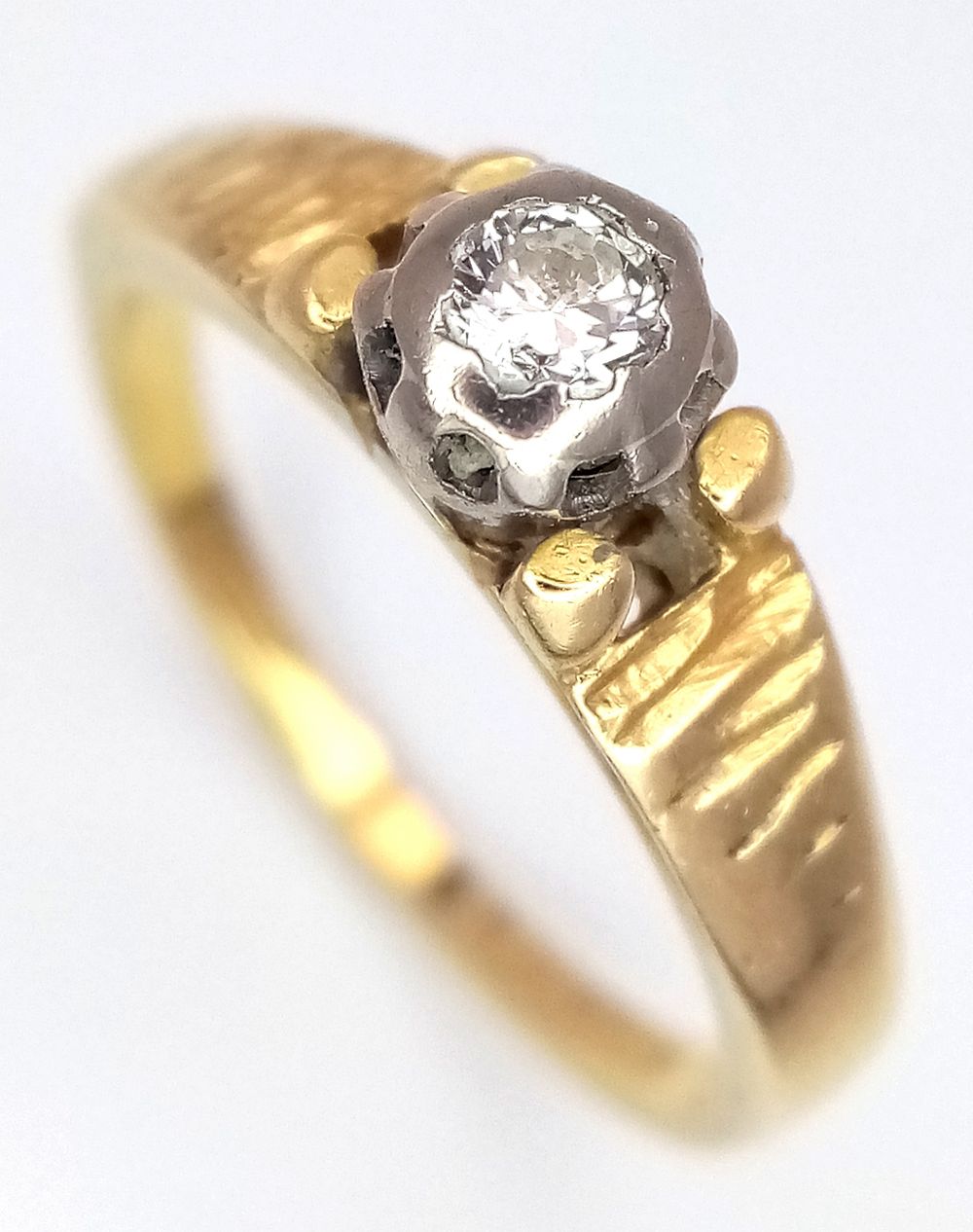 An 18K Yellow Gold Diamond Solitaire Ring. Size J 1/2. 3.15g. Full UK hallmarks.