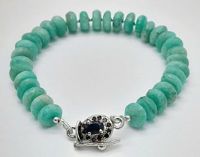 A Blue Apatite Gemstone Rondelle Tennis Bracelet. Sapphire and silver clasp. 18cm. 18.8g. CD-2041.