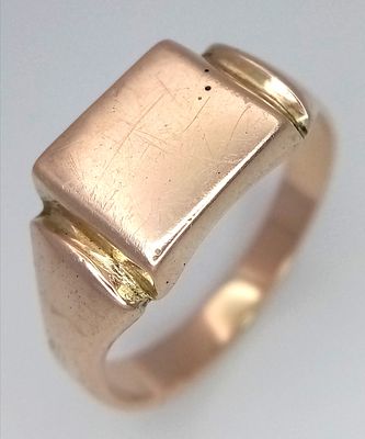 A 9K Yellow Gold Signet Ring. Size T 1/2. 5.57g.