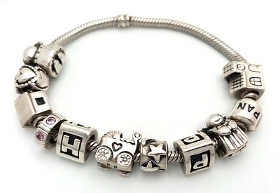 Genuine PANDORA SILVER BRACELET with 10 x SILVER PANDORA CHARMS. Approx 45 Grams. 18 cm.