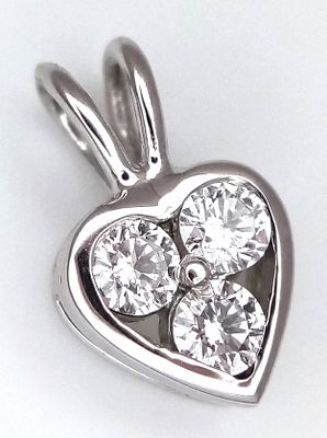 An 18K White Gold and Diamond Heart Pendant. 12mm. Three round brilliant cut diamonds. 1.15g. MT14.