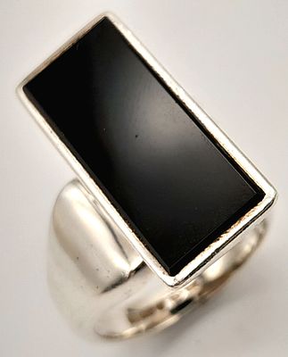 A 925 silver Black Onyx rectangular design fashion ring. Total weight 11G, Size O.