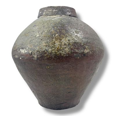 An Ancient Oriental Brown-Glazed Storage Jar. Handcrafted stoneware exterior with earthy brown 